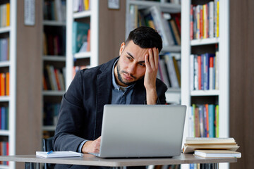 Man suffering migraine massaging head © yk_stock