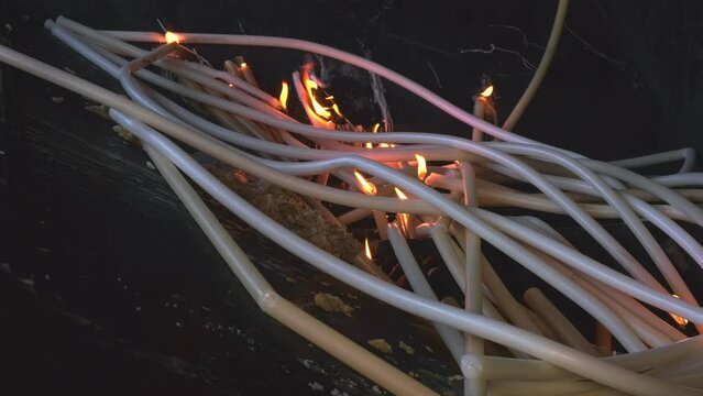 Lighting and burning candles as prayer and promise, Fatima, Portugal