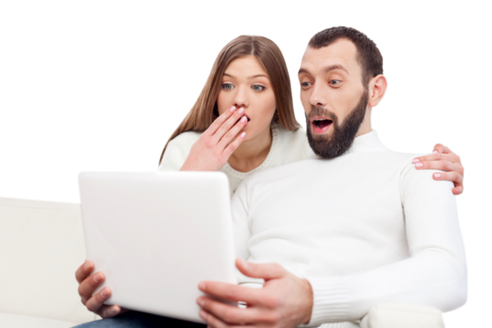 Portrait of a happy young couple learning how to use a laptop