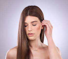 Face, beauty and haircare of woman with straight hair in studio isolated on a background. Natural cosmetics, growth and female model with salon treatment for healthy keratin, balayage or hairstyle.