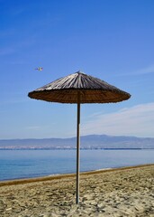 Beach umbrella on the beach in Peraia, Thessaloniki, Greece