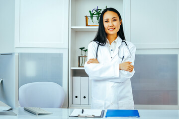 Female doctor with hand on chin, thinking
