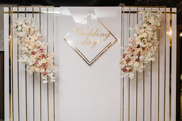 Arch with text wedding day. Wedding reception for luxury ceremony. Photo wall, arch decorated...