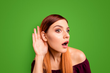 Portrait of red straight-haired attractive cute nice curious cunning young girl, overhearing with...