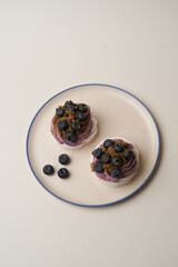Meringue cupcake with blueberry and pistachio