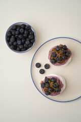 Meringue cupcake with blueberry and pistachio