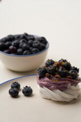 Meringue cupcake with blueberry and pistachio