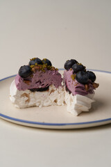 Meringue cupcake with blueberry and pistachio