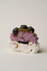 Meringue cupcake with blueberry and pistachio