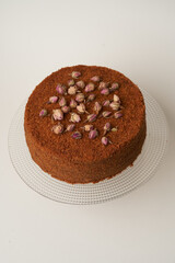 Chocolate honey cake on a white background