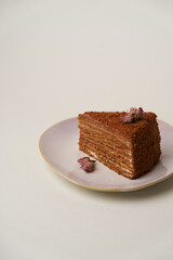Chocolate honey cake on a white background