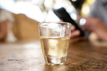 Closeup of a shot glass with rakia
