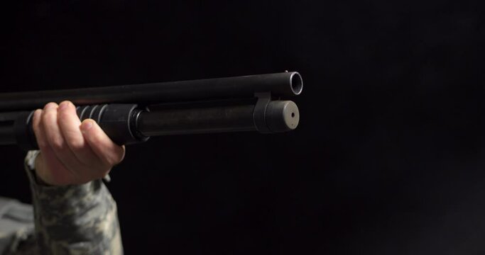 4K - Shooting a Pump Action Shotgun. Close-up scene with sound