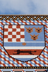 The medieval coat of arms of Croatia, Dalmatia and Slavonia on the tiled roof of St. Mark's Church in Zagreb