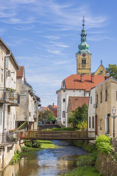 Moody image of the Church of St. Anastasia, seen from the bridge over the Gradna River in the town center