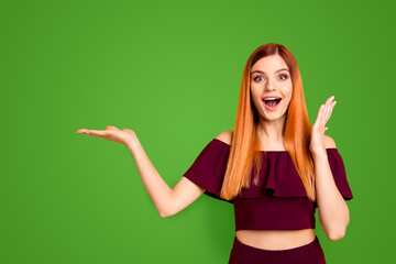 Omg wow unbelievable It takes first place in rating Closeup photo portrait of beautiful funny funky fancy with opened mouth lady holding empty copy space over palm isolated bright vivid background