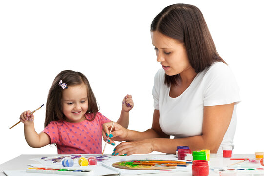 Happy mother and daughter painting