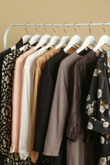 Women's Clothes. Clothes rack with stylish and elegant garments in fashion atelier. Good quality...