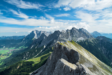 Wild alpine landscape with rocky mountains above Ehrwald at a beautfiful summer day. View to...