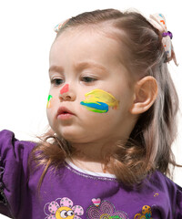 Little girl with paints on her face isolated on white background