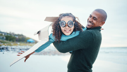 Beach, black family and daughter flying with her father while playing fantasy or pretend with imagination. Portrait, fun or plane with a man parent and girl child pilot bonding through play