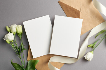 Blank wedding invitation card mockup with envelope and flowers, front and back sides, mockup with...