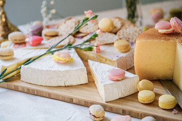 Chees and macaroons on the table, wedding candy bar
