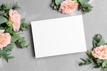 Wedding invitation or greeting card mockup with fresh roses flowers