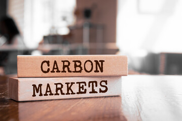Wooden blocks with words 'Carbon markets'.