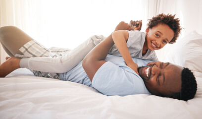 Children, love and bedroom with a playful black family having fun in the morning together after waking up. Kids, smile or laughing with a father and happy son playing or joking on a bed in their home - obrazy, fototapety, plakaty