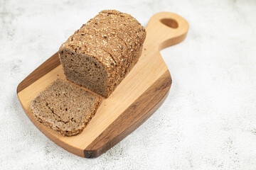 Top view healthy food sliced bread cereals wooden cutting board