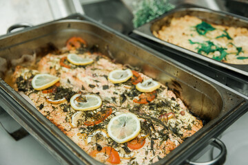 Catering buffet for events and parties. Food styling and restaurant meal serving. Salmon with...