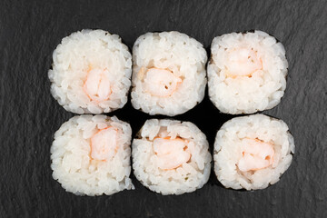 Above ground Japanese sushi food. Maki and rolls with tuna, salmon, shrimp, crab and avocado. Top view of various sushi, all you can eat menu. Rainbow sushi roll, uramaki, hosomaki and nigiri.