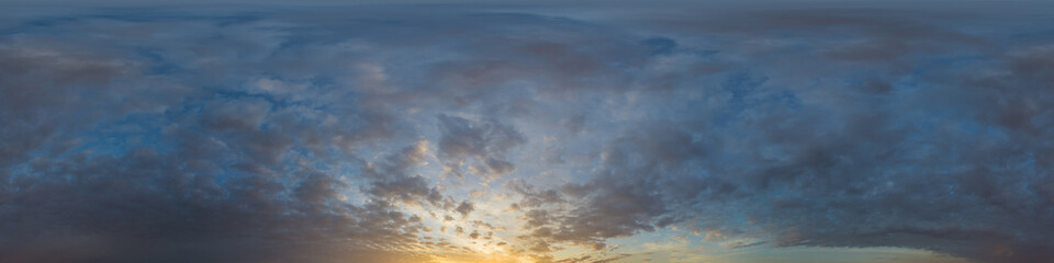 Panorama of a dark blue sunset sky with golden Cumulus clouds. Seamless hdr 360 panorama in spherical equiangular format. Full zenith for 3D visualization, sky replacement for aerial drone panoramas.