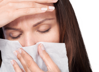 Sick young woman girl with sneezing in tissue