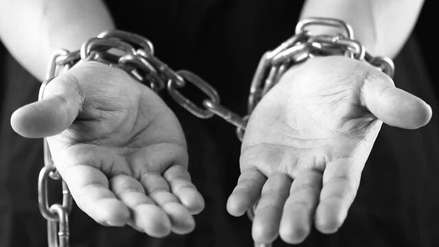 Hands in chains  , close up in studio  Chiangmai  Thailand.