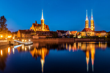 Wroclaw. Poland. View at Tumski island and Cathedral of St John the Baptist with bridge through river Odra - obrazy, fototapety, plakaty
