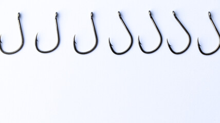 close up shot of fish hook on white background