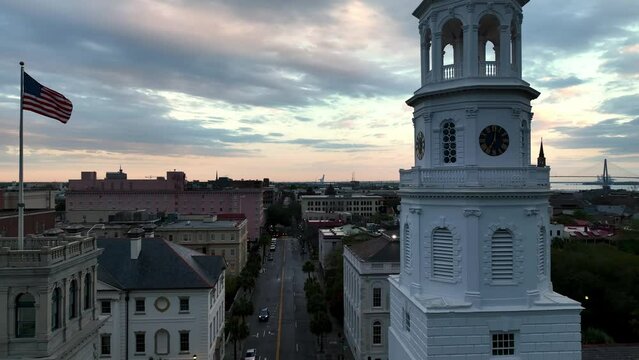 sunrise aerial charleston sc, south carolina with american flag and church steeple