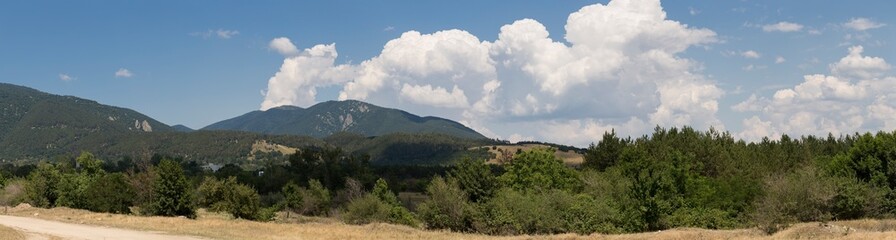 Fototapeta na wymiar Panoramic terrain of southern Europe. Landscape of Bulgaria-mountains, fields, flora.