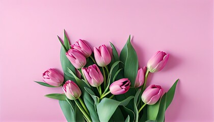 Fototapeta premium Bouquet of pink tulips flowers on pastel pink background