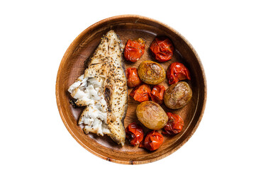 Baked halibut fish with roasted tomato and potato in wooden plate.  Isolated, transparent...