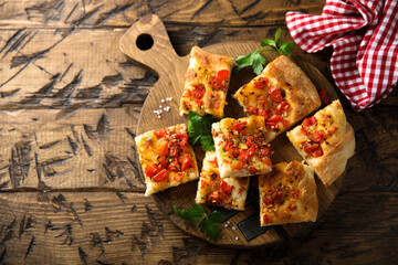 Traditional homemade focaccia with tomatoes