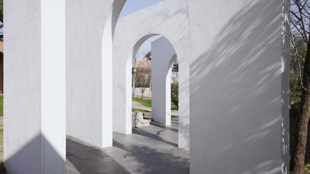 white wall with arch door