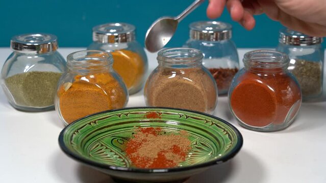 Spices for cooking - Cumin, paprika, curry, turmeric, chilli pepper, pepper, salt, ginger are typical spices of African Moroccan Indian cuisine - health and well-being in  kitchen - Mediterranean diet