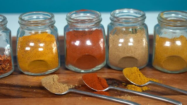 Spices for cooking - Cumin, paprika, curry, turmeric, chilli pepper, pepper, salt, ginger are typical spices of African Moroccan Indian cuisine - health and well-being in  kitchen - Mediterranean diet