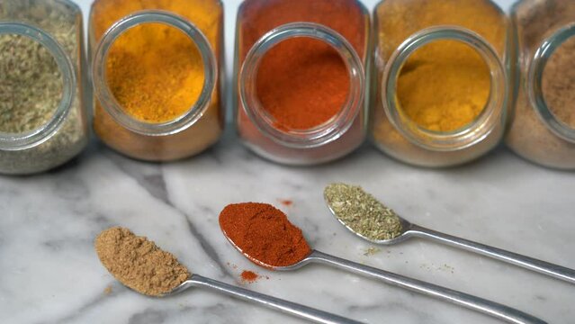 Spices for cooking - Cumin, paprika, curry, turmeric, chilli pepper, pepper, salt, ginger are typical spices of African Moroccan Indian cuisine - health and well-being in  kitchen - Mediterranean diet