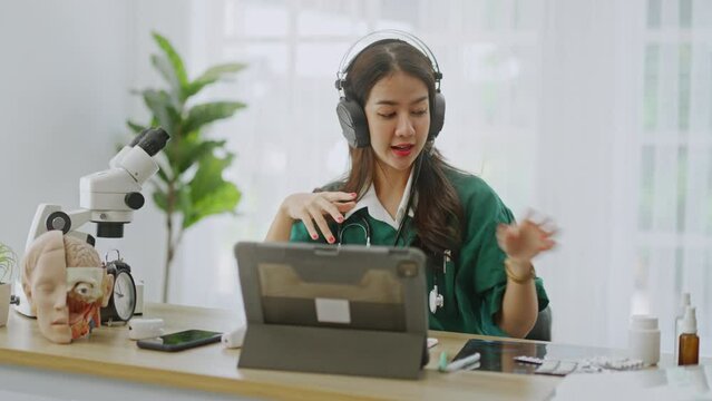Tele medicine,teledermatology concept,Asian woman Doctor with headset using video call app consultation,online communicating the patient on VR medical interface with Internet Telemedicine technology