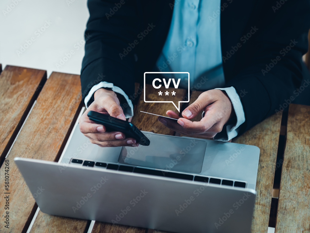 Poster cvv code in speech bubble appears while businesswoman using smart phone and holding credit or debit 