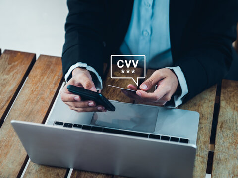 CVV code in speech bubble appears while businesswoman using smart phone and holding credit or debit card, paying for shopping online. Secure payment, safety banking transaction mobile application.